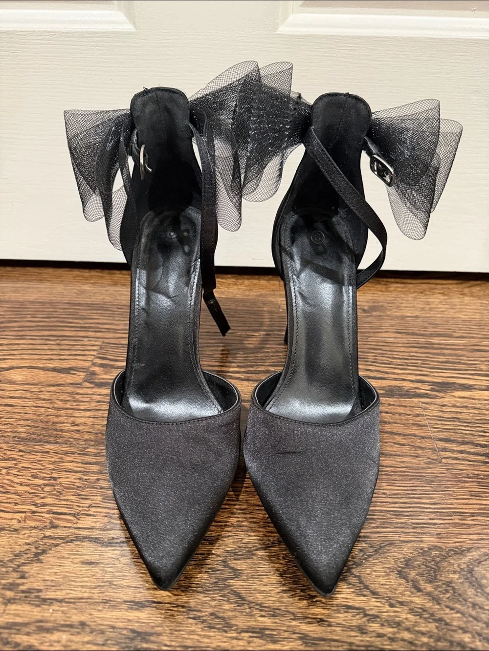 Elegant Black Pointed-Toe Ankle-Strap Heels with Bow Accent